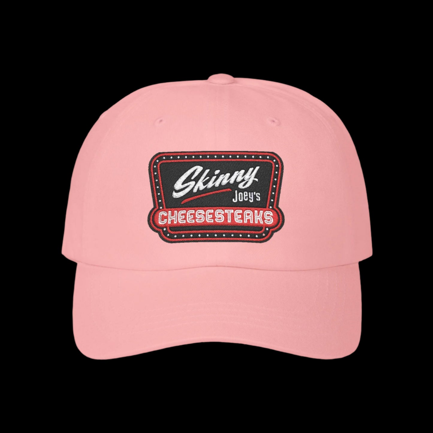 Pink cap with 'Skinny Joey's Cheesesteaks' patch on a black background.Skinny Joey Merlino hat, Skinny Joey merch, Joey Merlino hat, Philly cheesesteak hat, Skinny Joey’s Cheesesteaks streetwear, Joey Merlino apparel, The Skinny Podcast hat, mob-inspired fashion, South Philly cap, Skinny Joey red logo hat.