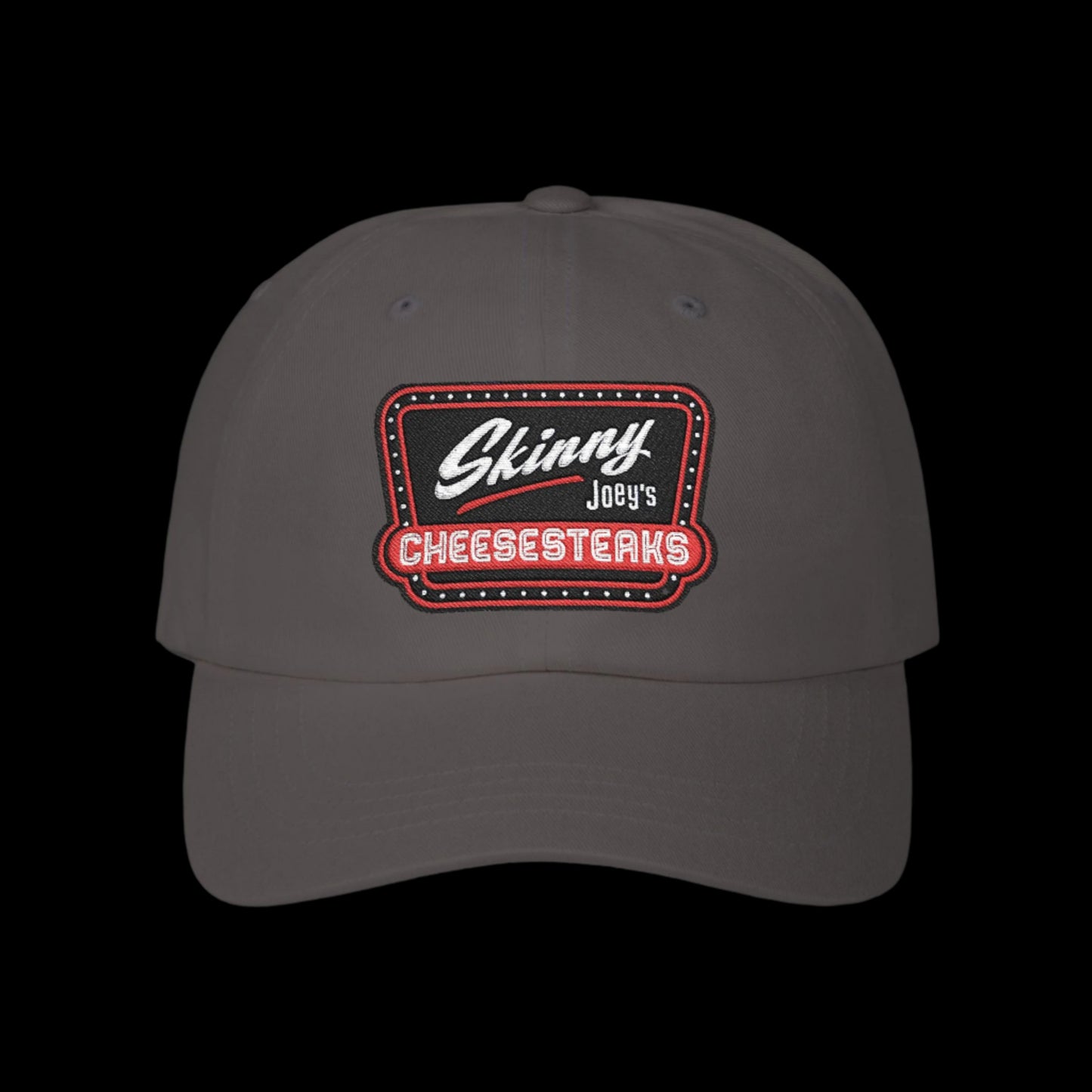 Gray cap with 'Skinny Joey's Cheesesteaks' logo on a white background.Skinny Joey Merlino hat, Skinny Joey merch, Joey Merlino hat, Philly cheesesteak hat, Skinny Joey’s Cheesesteaks streetwear, Joey Merlino apparel, The Skinny Podcast hat, mob-inspired fashion, South Philly cap, Skinny Joey red logo hat.