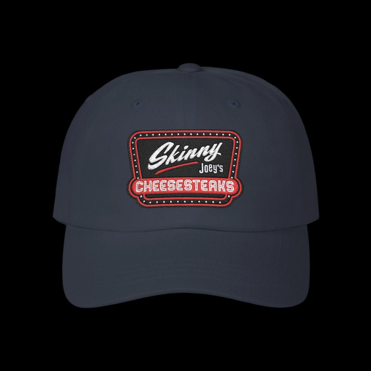 Navy blue cap with 'Skinny Joey's Cheesesteaks' logo on a white background.Skinny Joey Merlino hat, Skinny Joey merch, Joey Merlino hat, Philly cheesesteak hat, Skinny Joey’s Cheesesteaks streetwear, Joey Merlino apparel, The Skinny Podcast hat, mob-inspired fashion, South Philly cap, Skinny Joey red logo hat.