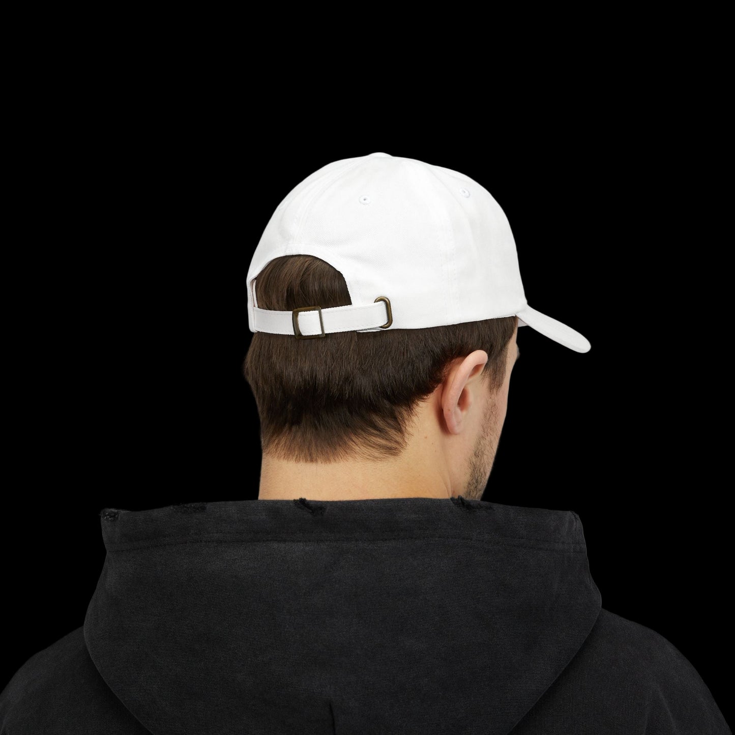 Person wearing a white cap and black hoodie from behind on a white background