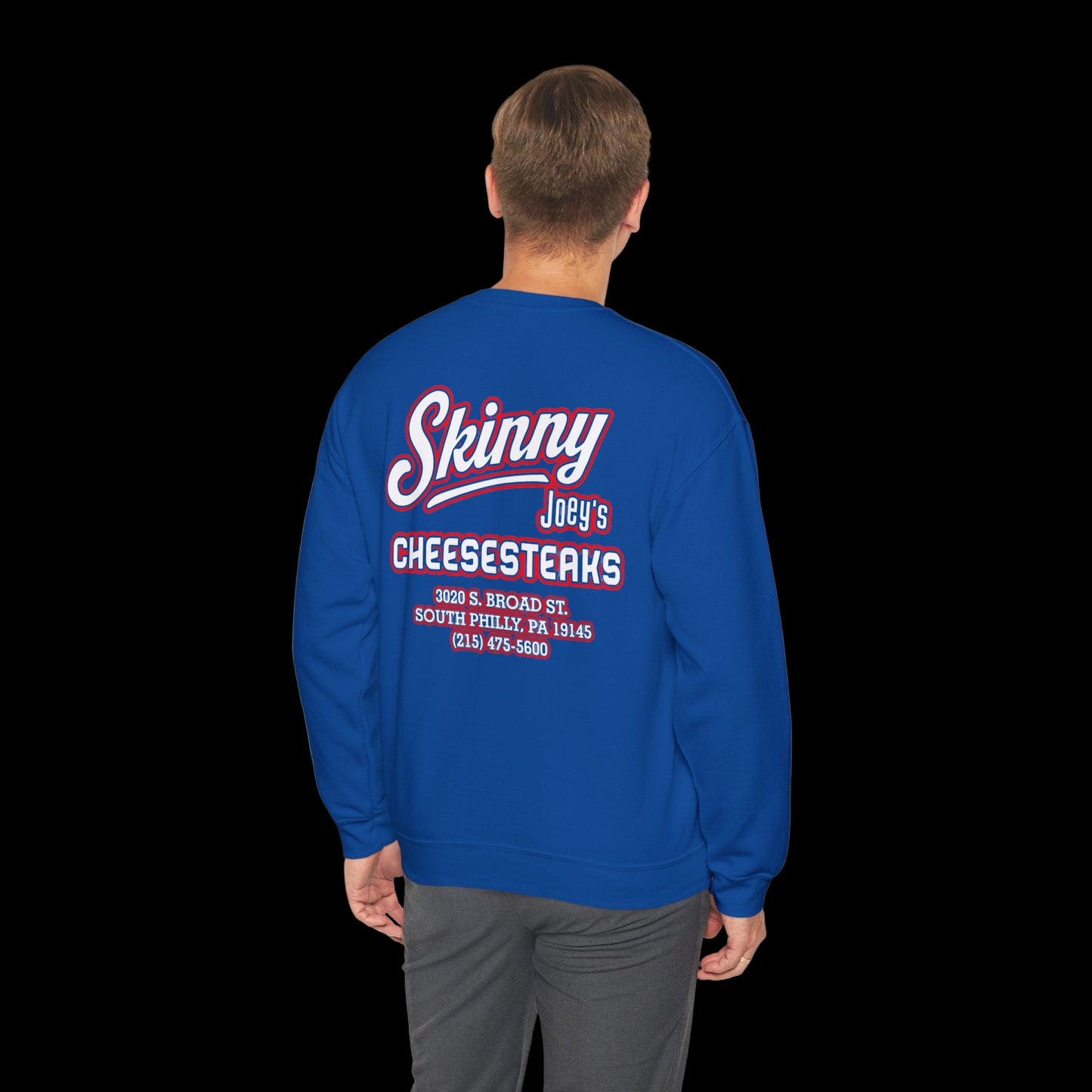 Blue sweatshirt with text on the back worn by a person, on a white background