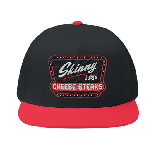 Black and red cap with 'Skinny Joey's Cheese Steaks' logo on a white background