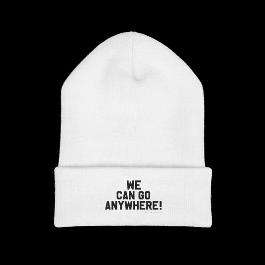 White beanie with 'WE CAN GO ANYWHERE!' text on a black background