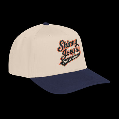 Beige and navy cap with 'Skinny Joey's Cheesesteaks' logo on a white background