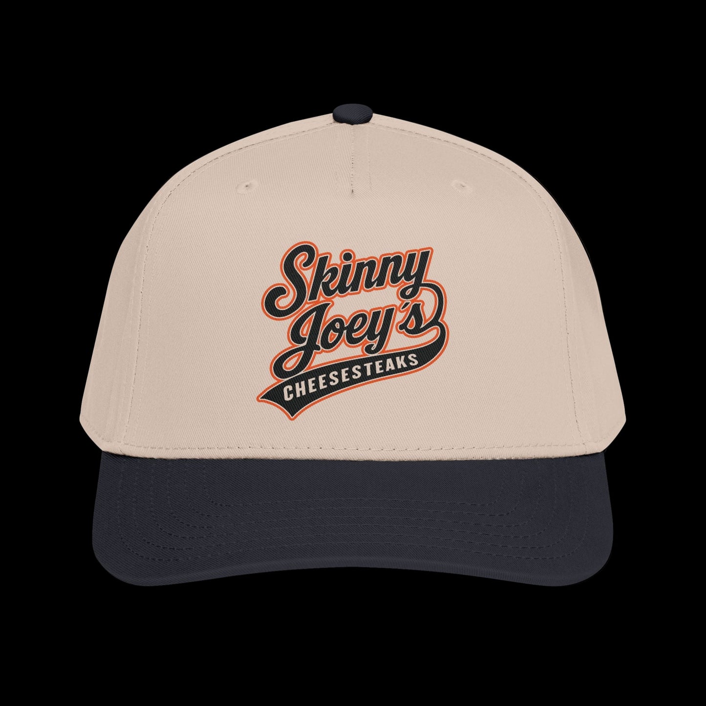 Beige and navy cap with 'Skinny Joey's Cheesesteaks' logo on a white background