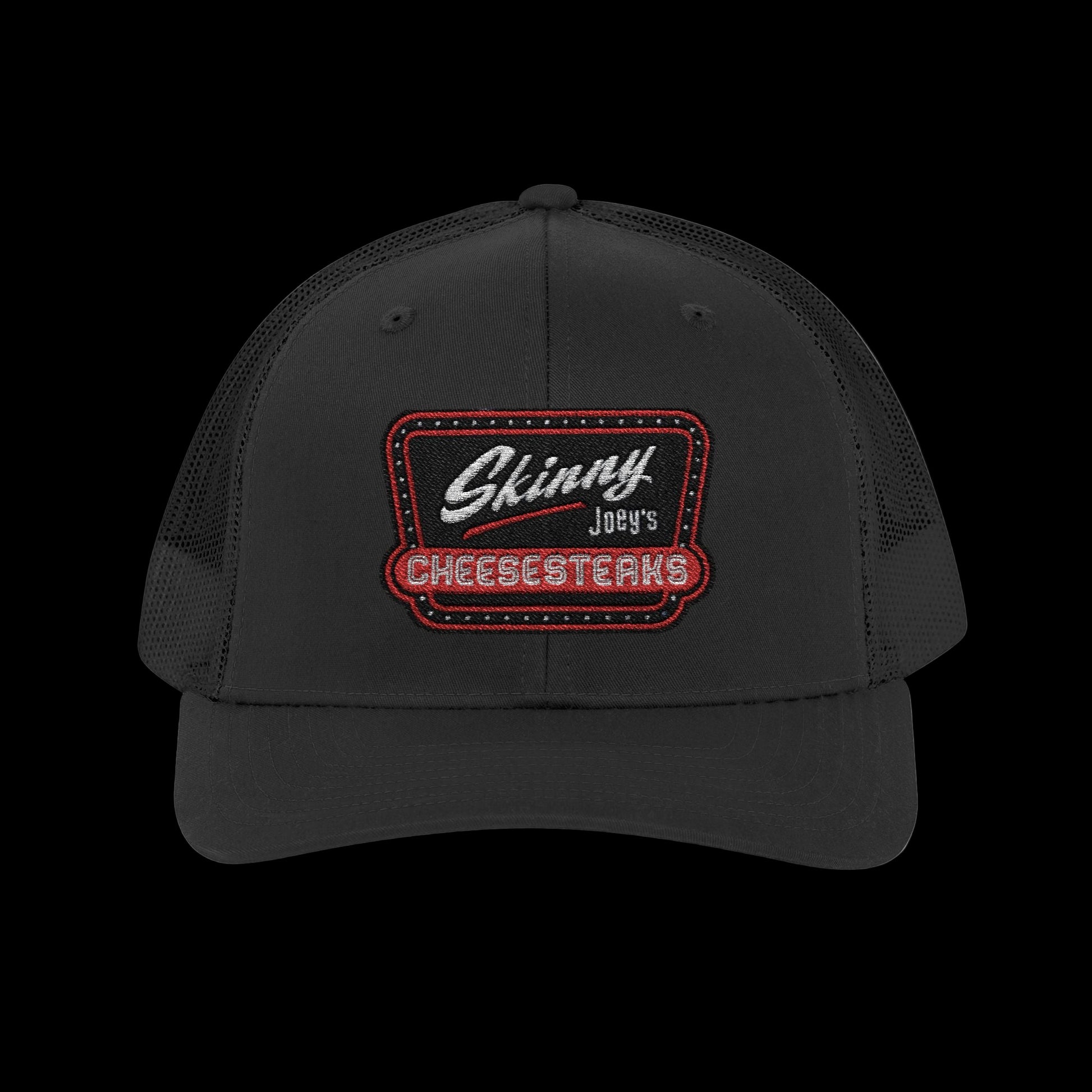 Black cap with 'Skinny Joey's Cheesesteaks' logo on a white background