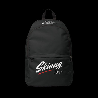 A black backpack with a front zippered pocket featuring the text 'Skinny Joey's' in white script with a red underline, and 'My Game Anywhere.' printed in white near the top, shown on a plain white background.