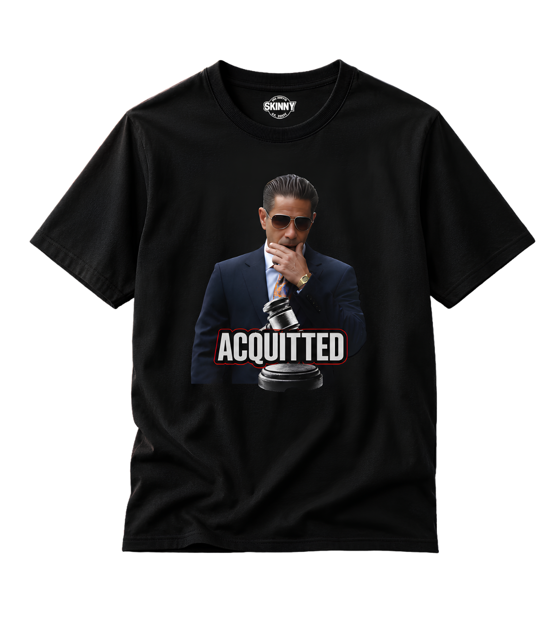 A black short-sleeve t-shirt with a graphic print of a man in a suit and sunglasses holding a gavel, with the word 'ACQUITTED' in bold white letters. The inner neck label shows the brand 'SCNYY'.