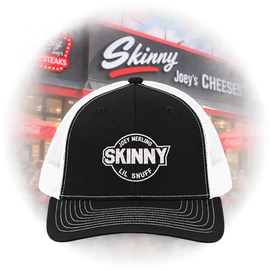 Skinny logo trucker cap in black and white, shop front scene, South Philly