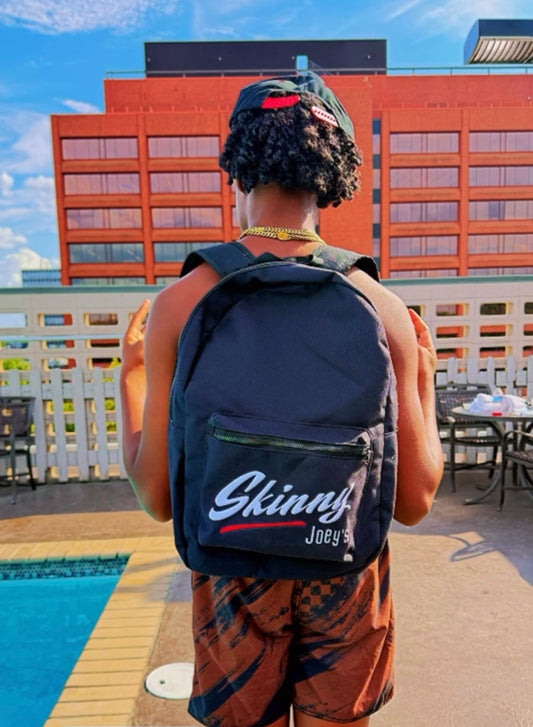 Skinny Joey's backpack in navy, worn poolside, Skinny Joey's Cheesesteaks