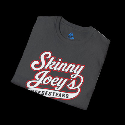 Folded t-shirt with 'Skinny Joey's Cheesesteaks' text on a white background
