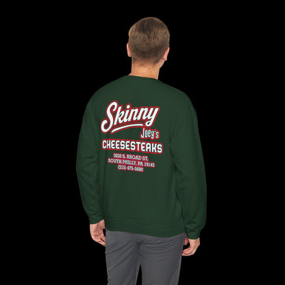 Green sweatshirt with red and white text on the back, worn by a person on a white background