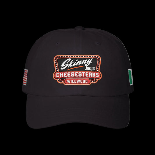 Black cap with 'Skinny Joey's Cheesesteaks Wildwood' logo on a white background