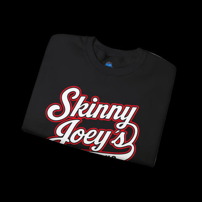 Folded black t-shirt with 'Skinny Joey's' text on a white background