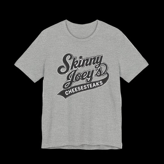 Gray t-shirt with 'Skinny Joey's Cheesesteaks' text on a white background