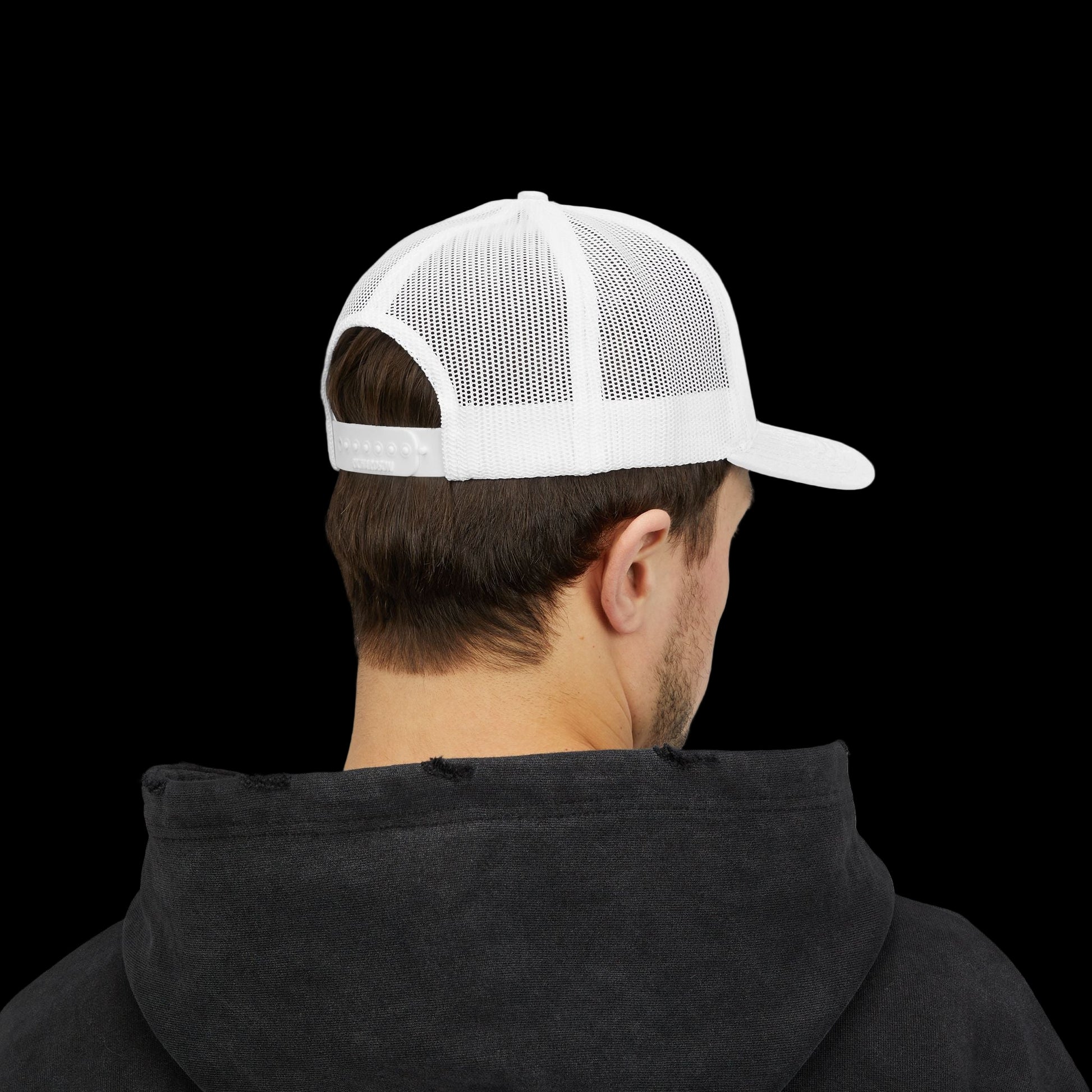 Person wearing a white mesh cap and black hoodie on a white background