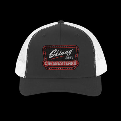 Black and white cap with 'Skinny Joey's Cheesesteaks' logo on a white background