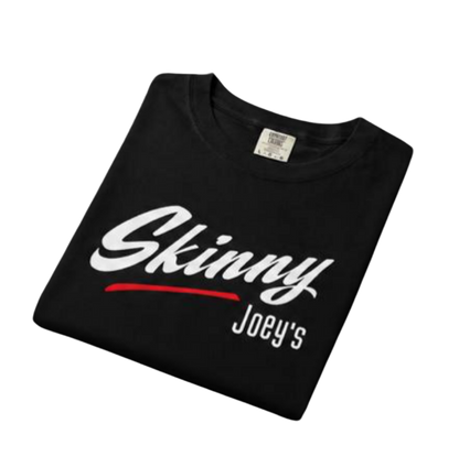 Folded black t-shirt with 'Skinny Joey's' text on a white background