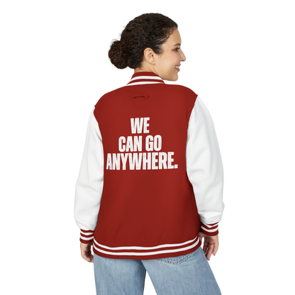 Person wearing a red and white letterman jacket with 'WE CAN GO ANYWHERE.' text on the back.