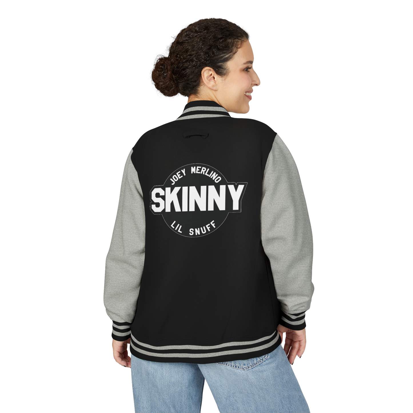 Person wearing a black and gray varsity jacket with 'SKINNY' text on the back.