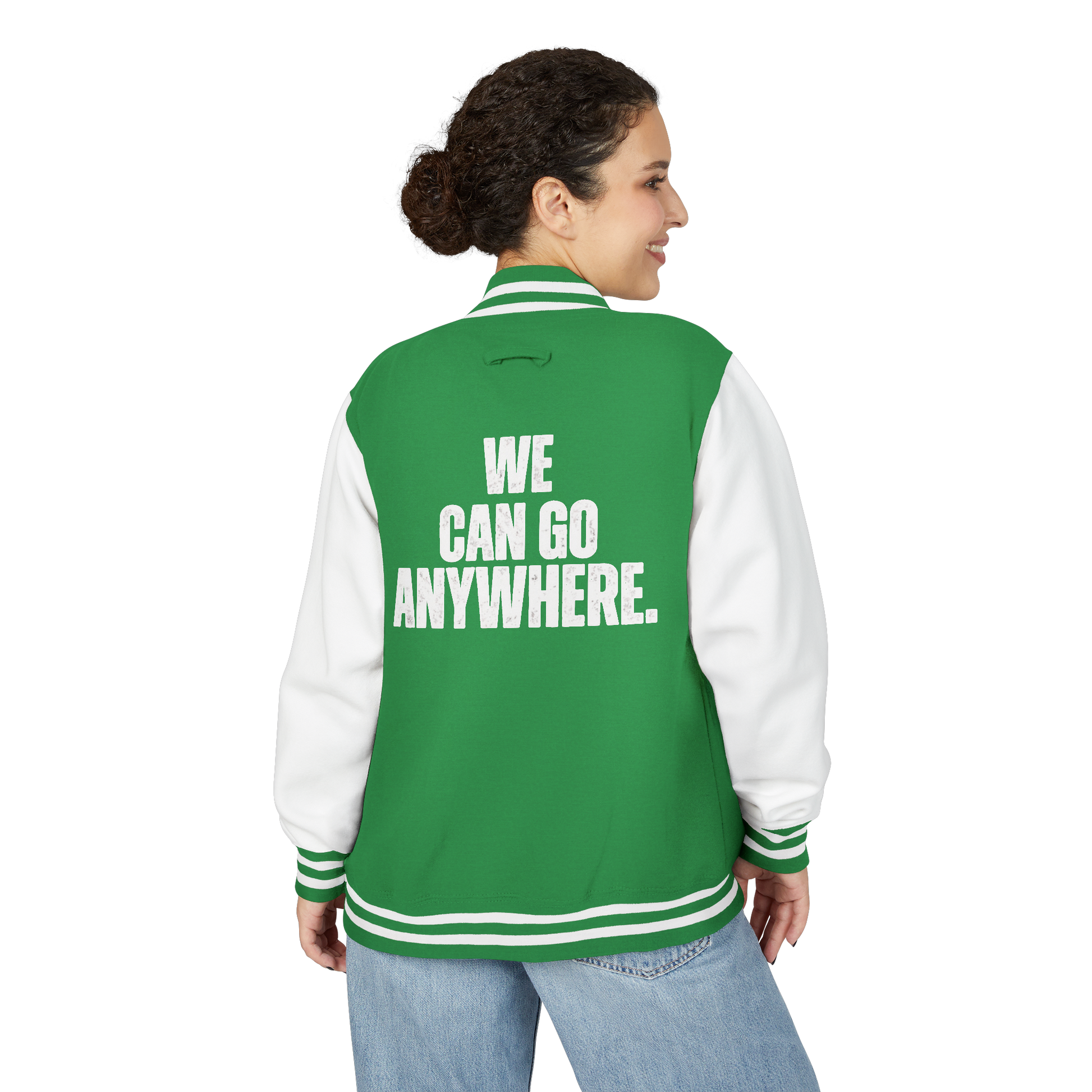 Person wearing a green and white jacket with 'WE CAN GO ANYWHERE.' text on the back.