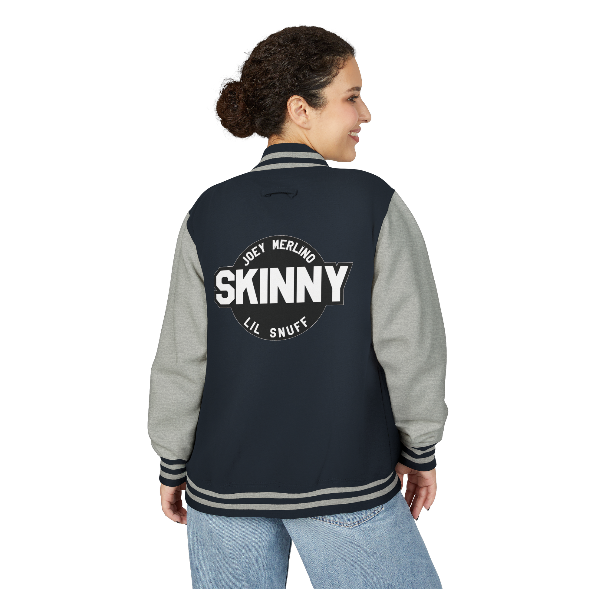 Person wearing a navy and gray varsity jacket with 'SKINNY' text on the back.
