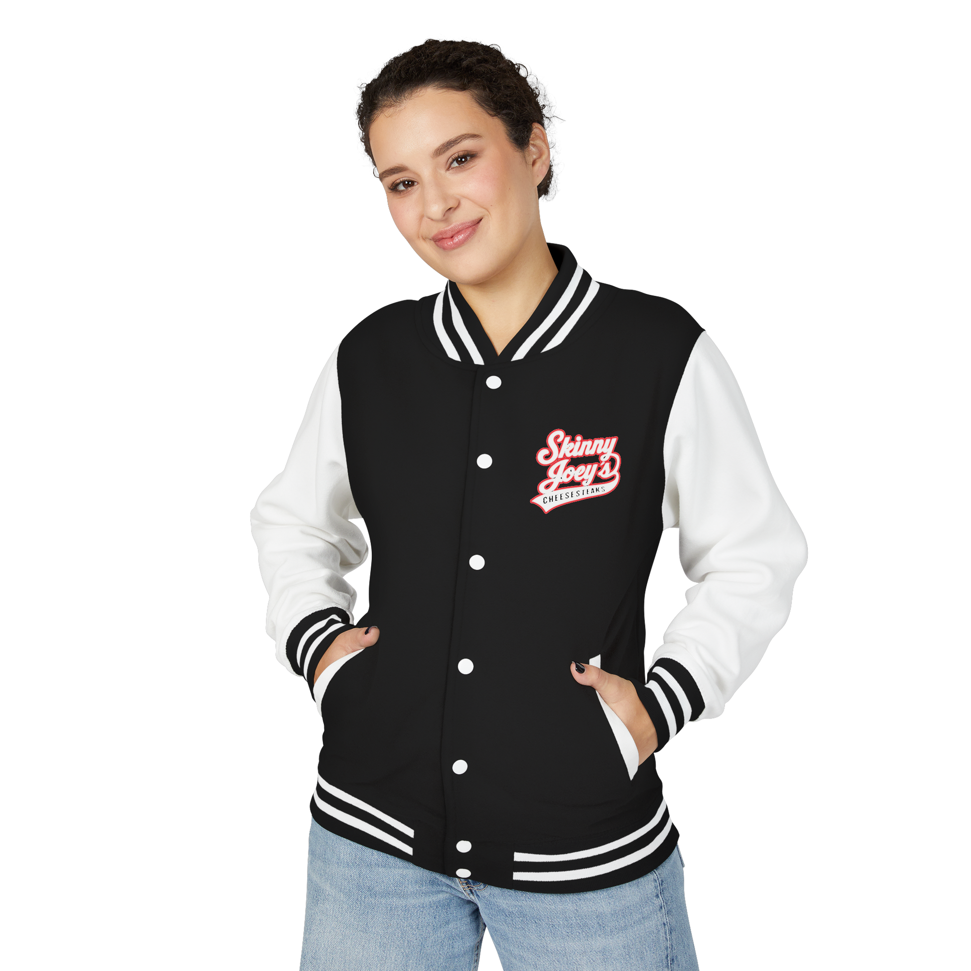Person wearing a black and white varsity jacket with a logo on a white background