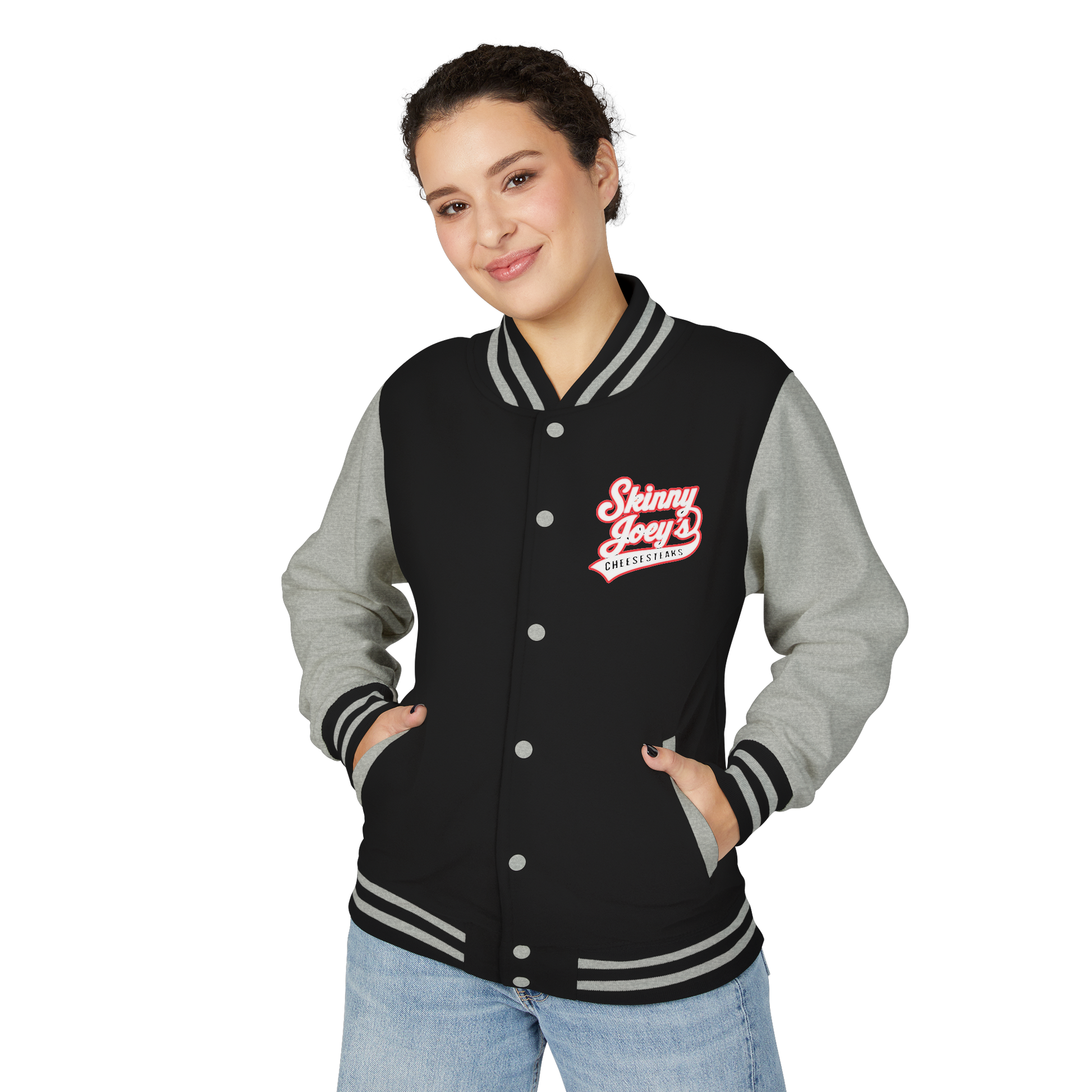 Person wearing a black and gray varsity jacket with a logo on a white background