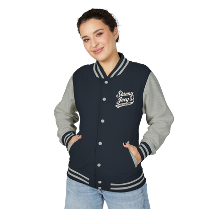 Person wearing a navy and gray varsity jacket with 'Skinny Joey's' logo on a white background