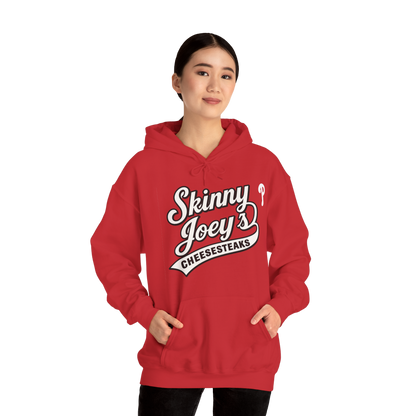 Person wearing a red hoodie with 'Skinny Joey's Cheesesteaks' text on a white background