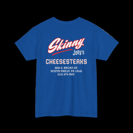 Blue t-shirt with 'Skinny Joey's Cheesesteaks' text on the back against a white background